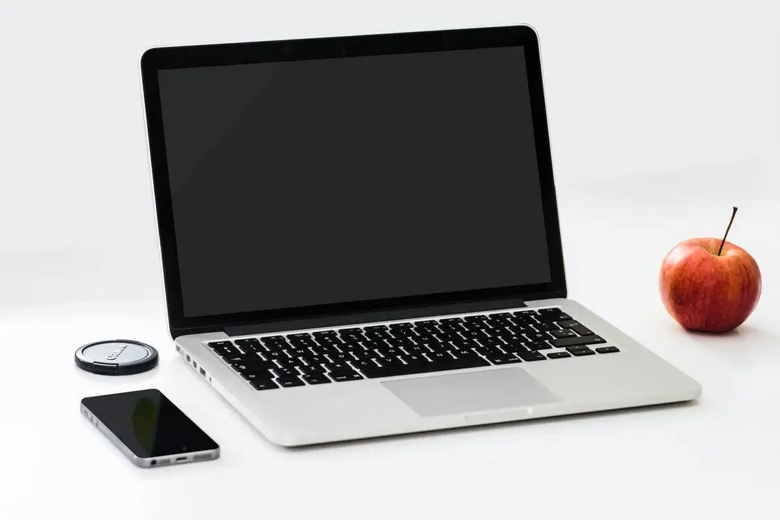 A computer open on a desk