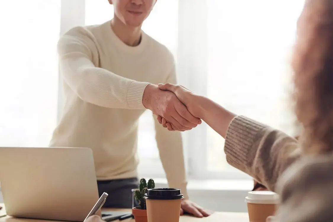 Shaking hand at a second job or side hustle