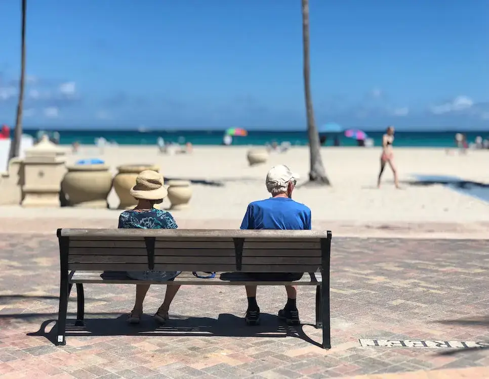 2 retired people on a beach